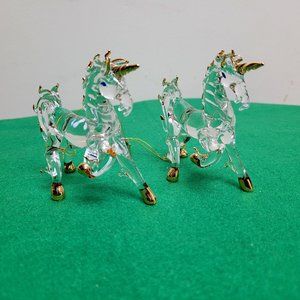 A pair of crystal unicorn ornaments